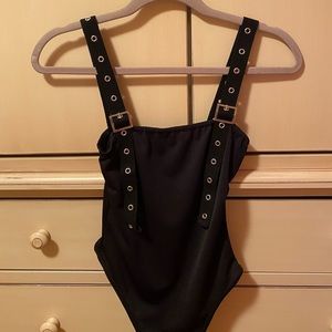Black body suit with buckle straps